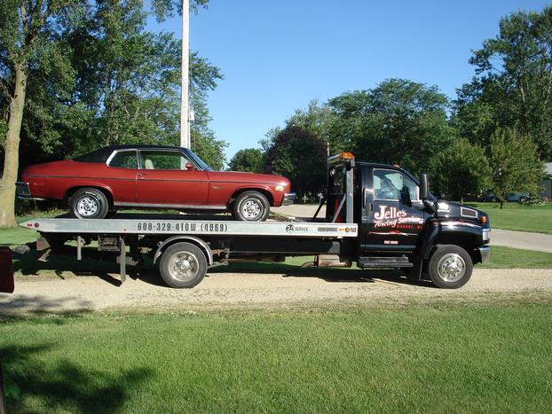 Tow truck hauling vehicle