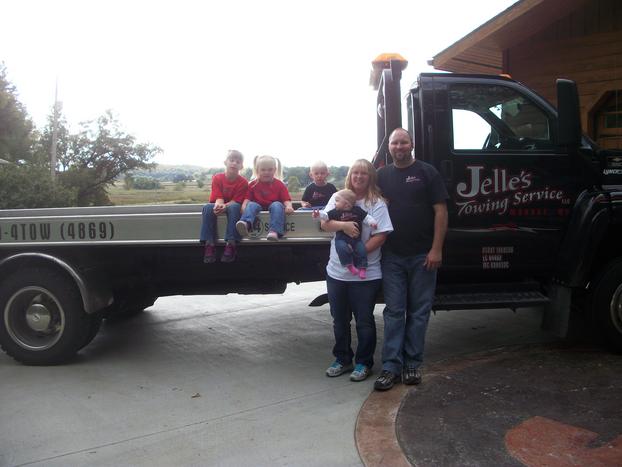 family picture with tow truck
