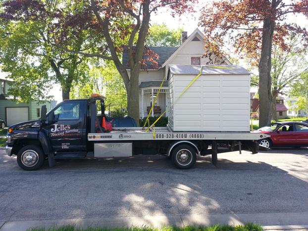 mini house getting towed for delivery